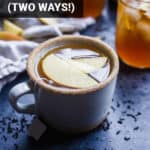 mug of apple cider tea with apple slices and a tea bag