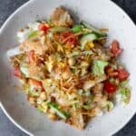 A vegan panzanella salad in a light bowl