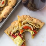 Gluten Free Pesto Pizza: A simple, delicious homemade pizza made with ingredients like pesto, roasted red peppers, and fennel! || fooduzzi.com recipes