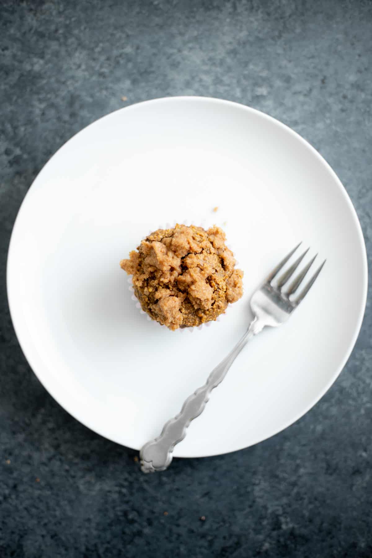 a vegan blender coffee cake muffin on a white plate